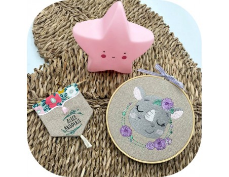 machine embroidery design  sleeping rhino with flowers