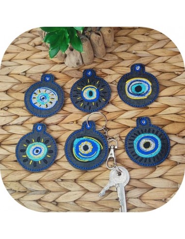 machine embroidery  design ith lot of   key ring lucky eye