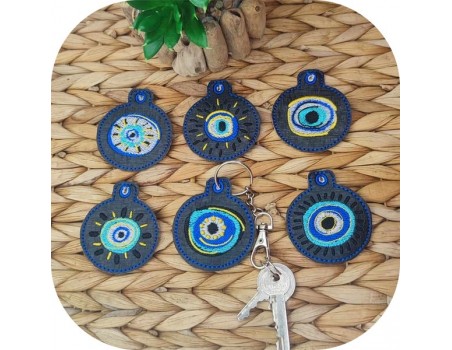 machine embroidery  design ith lot of   key ring lucky eye